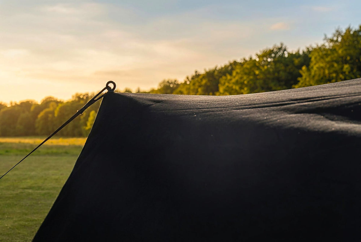 The sail edge tensioned with the storm strap. That is how it should sit.